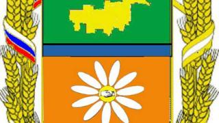 На эскизе герба Туркменского района - колосья, ромашка и рукопожатие